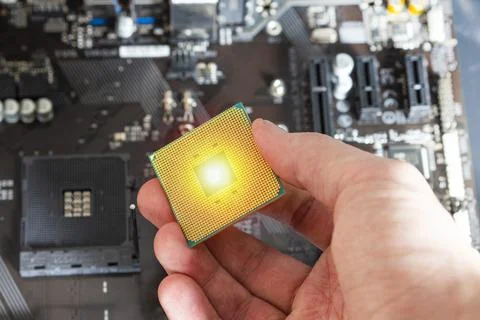 CPU in hand Stock Photos