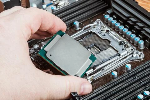 CPU in hand Stock Photos