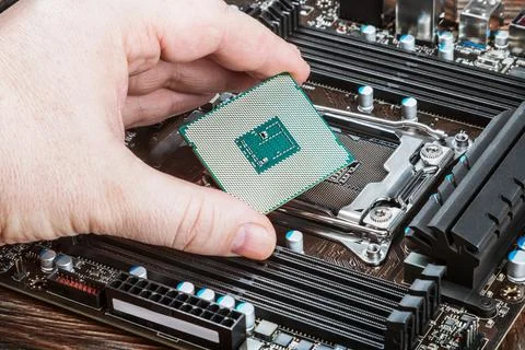 CPU in hand Stock Photos