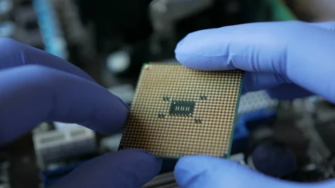 CPU in hands of a technician. The processor is being examined for apparent de 스톡 동영상 101603161