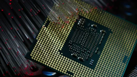 CPU illuminated by a bunch of colored fiber optics. zoom in Stock-Footage 219470210