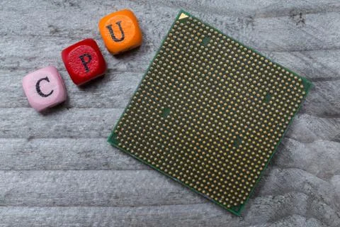 CPU letter cube and processor on gray wood visualization 스톡 사진