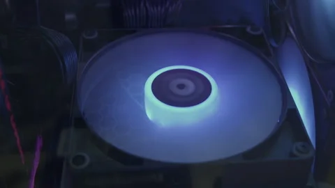 CPU liquid cooling radiator fan spinning with warm lighting 動画素材 340774600