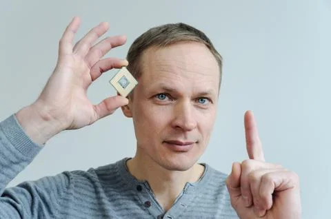 CPU in the man's hand. Stock Photos