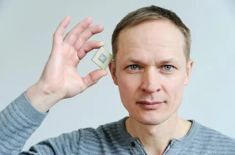 CPU in the man's hand. Stock Photos