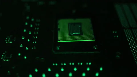 A CPU processor computer concept 4k footage on motherboard in rgb lights Stock Footage 136328627