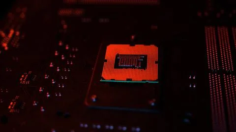 A CPU processor computer concept on motherboard in red lights 写真素材