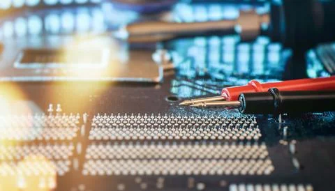 CPU Processor Pin Testing with Multimeter Probes for Computer Hardware Diagno Stock Photos