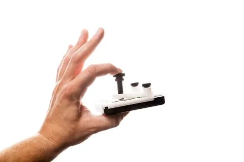 CPU in relid device in man's hand isolated on white background. Фото