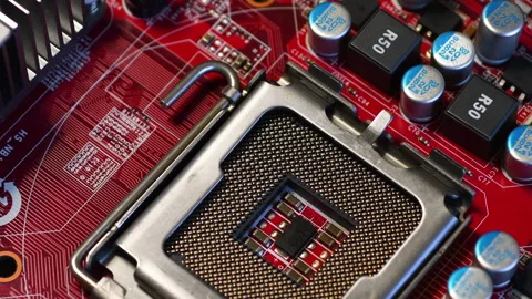 CPU socket of a red modern PC motherboard with electronic components Stock Footage 232424915