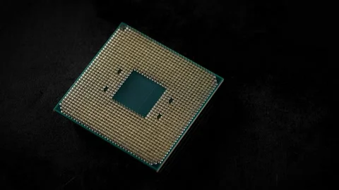 CPU. Studio macro photography of a computer processor. Gold plated contacts are Stock Footage 144421526