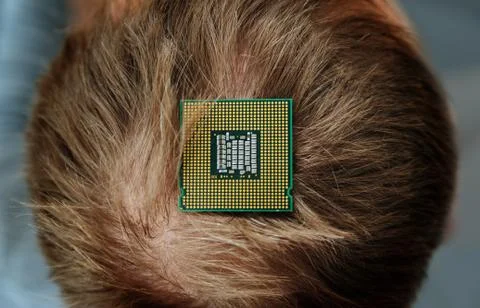 CPU is on the top of the human head. Stock Photos