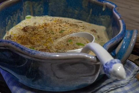 Crab and corn bisque or chowder in blue and white crockery. Stock Photos