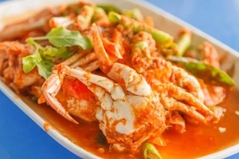 Crab in red curry paste Stock Photos
