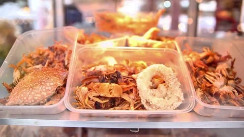 Crab rice and squid in a display case for sale Stock Footage 272297856