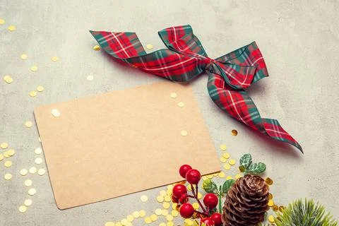 Crab sheet for writing with a red bow on a concrete background with sequins Stock Photos