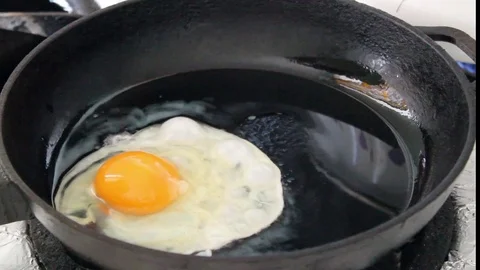 Crack And Cooking Eggs In A Pan . Stock Footage 74093707