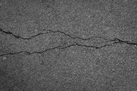 Crack asphalt background Stock Photos