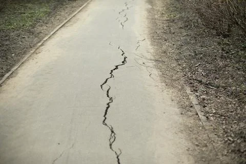 Crack in asphalt. Road with defect. Stock-Fotos