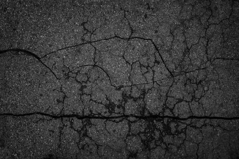 Crack background texture of rough asphalt top view Stock Photos