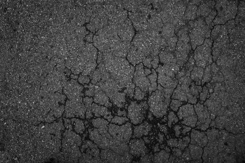Crack background texture of rough asphalt top view Stock Photos