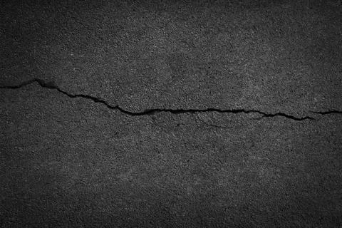 Crack background texture of rough asphalt Stock Photos