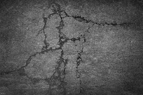 Crack background texture of rough asphalt Stock Photos