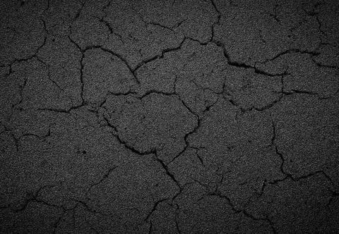 Crack background texture of rough asphalt Stock Photos