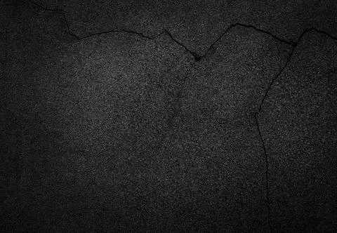 Crack background texture of rough asphalt Stock Photos