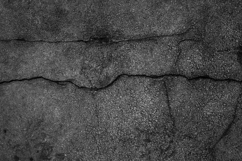 Crack background texture of rough asphalt Foto stock