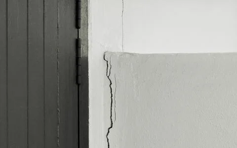 Crack between wall and column by collapsed soil Stock Photos
