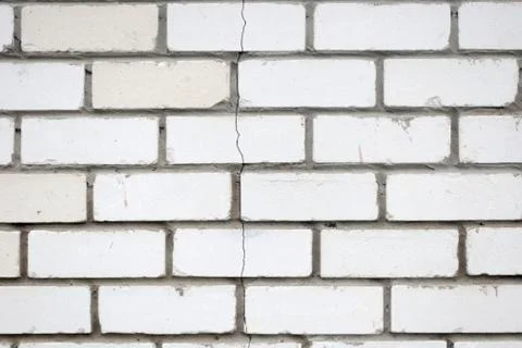 The crack in the brick wall. Stone Stock Photos