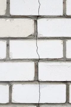 The crack in the brick wall. Stone Stock Photos
