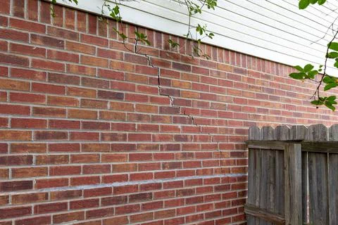 Crack in bricks of home from foundation problems Stock Photos