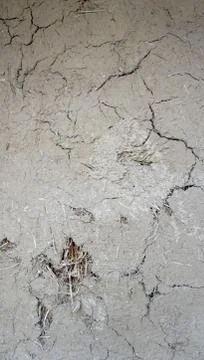 Crack on clay wall Stock Photos