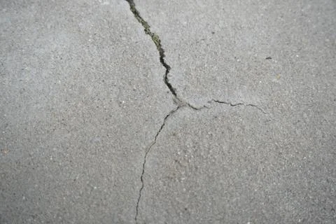Crack in concrete Stock Photos