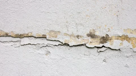 Crack in a concrete plaster wall. Damaged wall. Destruction surface,animation Stock Footage 335817475