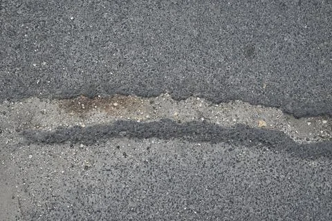 Crack in Concrete Surface, Texture Background Close-Up Fotos Stock