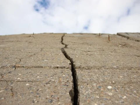 Crack in Concrete Wall with Cloud Perspective Stock Photos