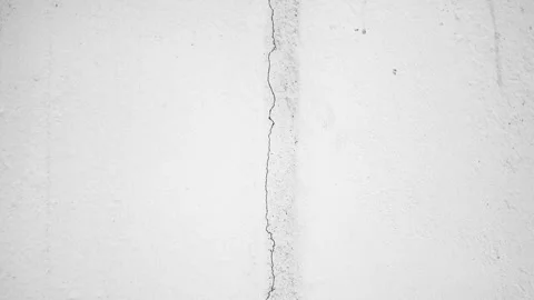 Crack in a concrete wall. Damage to a wall, foundation surface, animation. Stock Footage 316530518