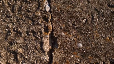 Crack, gap, or split in a concrete surface or slab view from above. Stock-Footage 347606576
