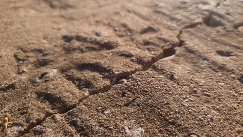 Crack, gap, or split in a concrete surface or slab. Stone surface concrete Stockbeeldmateriaal 347606622