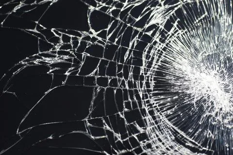 Crack on the glass. Broken screen. Broken phone. Cracked glass background. .. Stock Photos