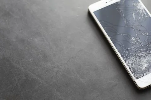 Crack on the glass. Broken screen. Broken phone. Cracked glass background. .. Stock Photos