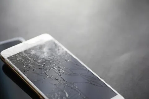 Crack on the glass. Broken screen. Broken phone. Cracked glass background. .. Stock Photos