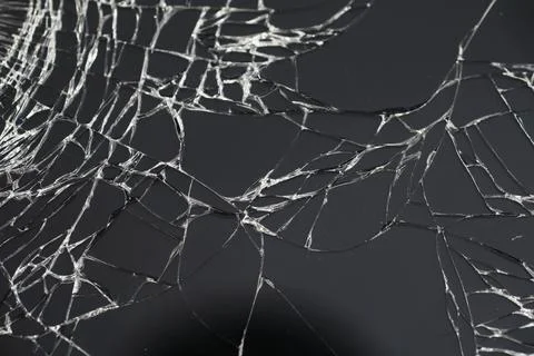 Crack on the glass. Broken screen. Broken phone. Cracked glass background. .. Stock Photos