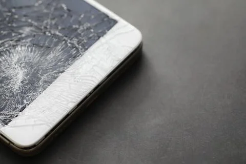 Crack on the glass. Broken screen. Broken phone. Cracked glass background. .. Stock Photos