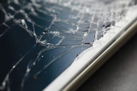 Crack on the glass. Broken screen. Broken phone. Cracked glass background. .. Stock Photos