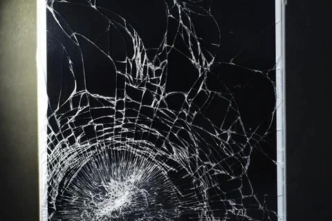 Crack on the glass. Broken screen. Broken phone. Cracked glass background. .. Stock Photos