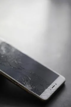 Crack on the glass. Broken screen. Broken phone. Cracked glass background. .. Stock Photos